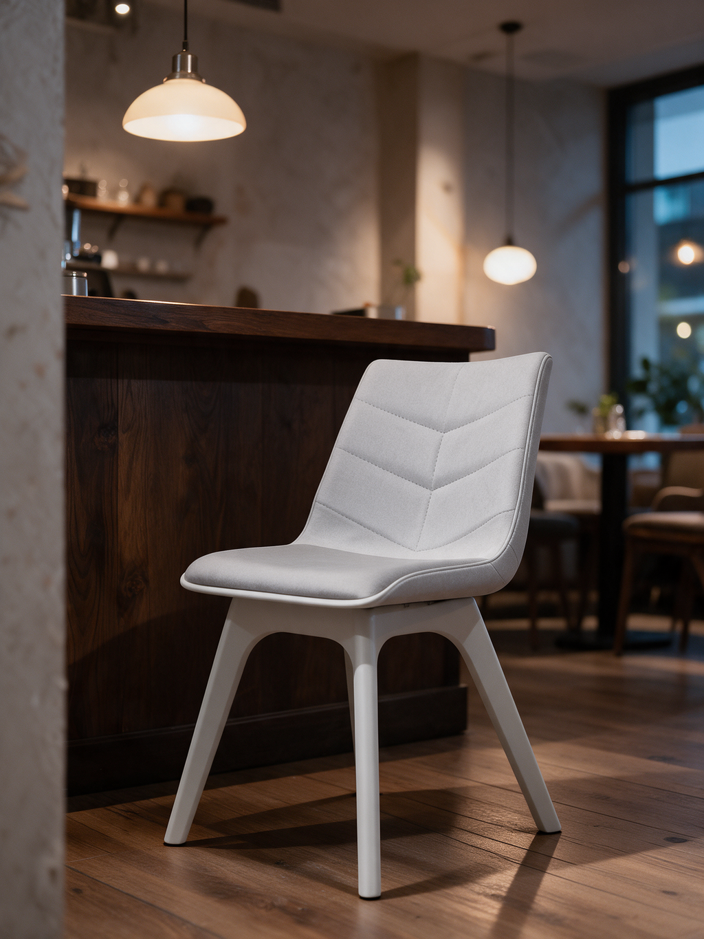 NIORA Arrow Cushion cafe chair in a modern cafe in warm evening light