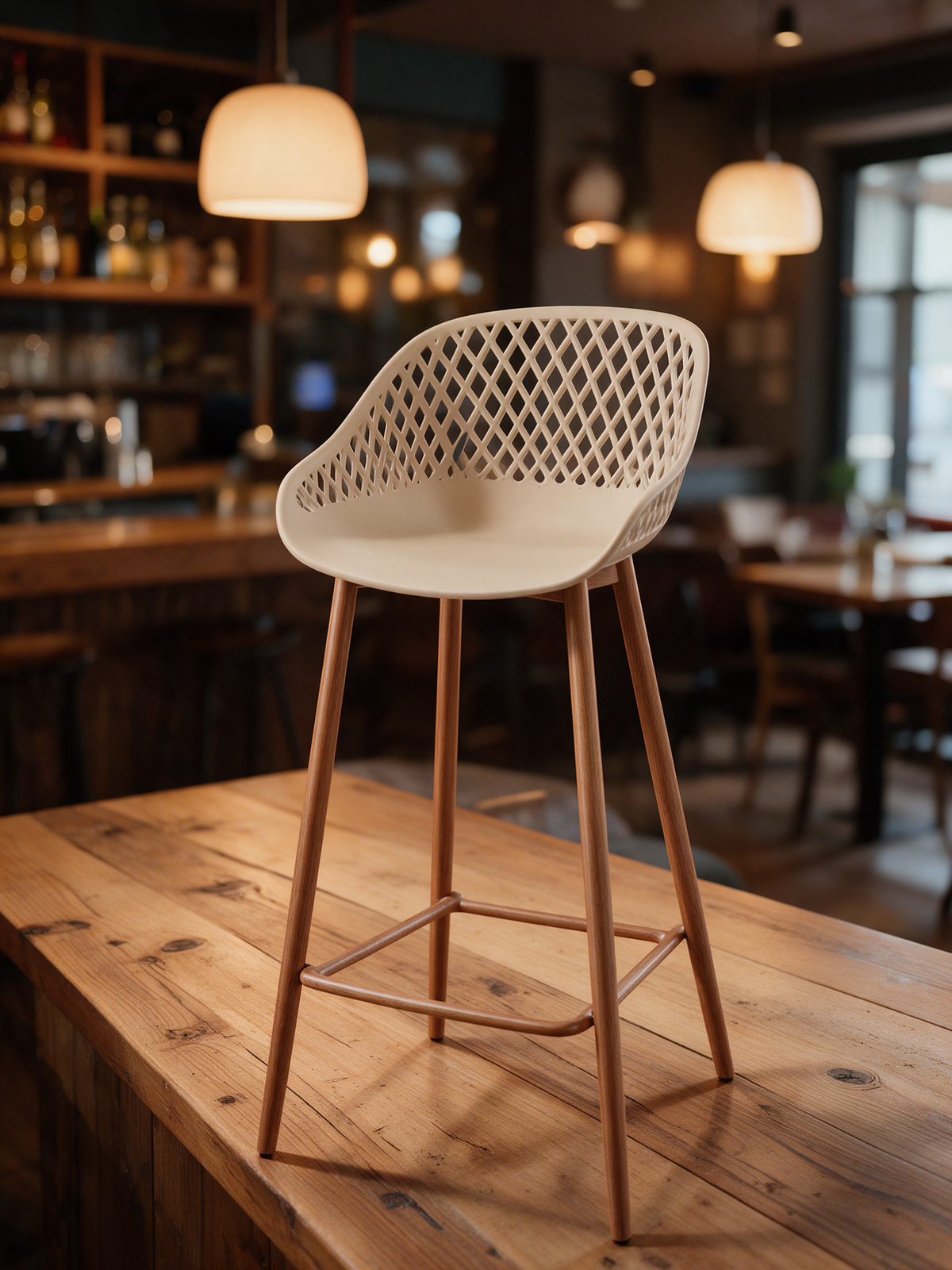 NIORA Nimbus high chair at a bistro counter in warm evening light