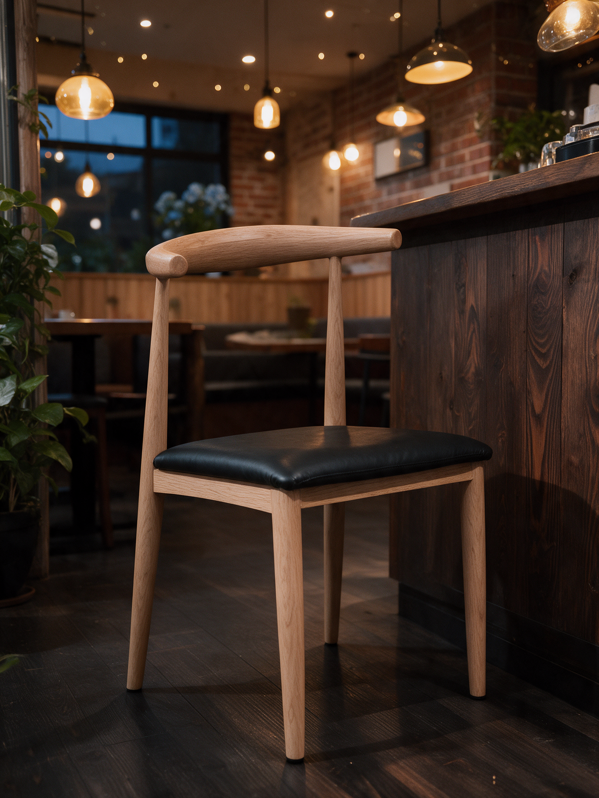 NIORA Sleek cafe chair in a modern cafe in warm evening light